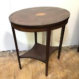 An Edwardian mahogany occasional table, the oval top with central flower inlay above a concave lower