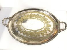 A large Epns tray with beaded C scroll handles to side and elaborate etched design (49cm x 76cm)