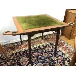 A 1930s/40s oak folding card table with two foldout game piece holders (one pot remaining) on