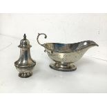 A Mappin & Webb Sheffield silver sauceboat with the initial E and a Mappin Webb Birmingham silver