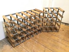 Two modern wood and metal wine racks, one with a twenty four bottle capacity, the other twelve (