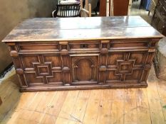 An attractively patinated 17thc oak coffer, the hinged lid with original iron hinges, with