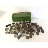 A 1940s/50s savings bank with six slots for specific savings, complete with a large assortment of