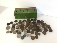 A 1940s/50s savings bank with six slots for specific savings, complete with a large assortment of