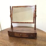 A Regency mahogany hinged dressing table mirror, the rectangular glass flanked by turned supports,