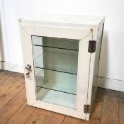A 1940s/50s metal and glass cabinet, painted white, with glass front and sides with three glass