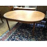 A G Plan oak extendable table, with rounded and crossbanded edges, with magic leaf mechanism, on