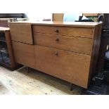 An Avalon 1960s/70s teak sideboard with an arrangement of drawers and cupboards including a fall