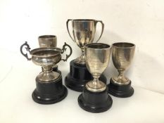 A collection of 1940s silver presentation trophies, including those for Long Jump, High Jump,