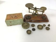 A set of early 20thc brass scales, complete with an assortment of weights and measures (scales: 11cm