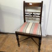 A 1920s Regency style side chair with drop in upholstered seat on turned supports with X