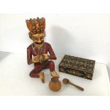A carved wooden figure of a Seated Prince (h.32cm x 21cm x 18cm), an ebonised and marquetry box