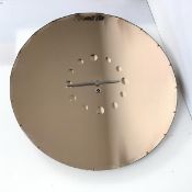 A 1960s/70s wall clock/mirror, the circular scalloped edge mirror with twelve discs denoting the