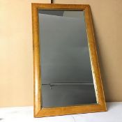 A wall mirror with moulded wooden frame (79cm x 44cm)