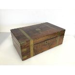 A 19thc brass bound walnut writing slope with fitted interior including a tooled leather writing