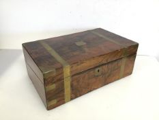 A 19thc brass bound walnut writing slope with fitted interior including a tooled leather writing