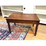 An early 20thc oak occasional table, the rectangular top with bevelled edge, on turned supports (