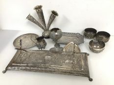 An assortment of Indian white metal objects including a presentation stand inscribed Presented to