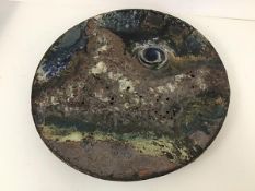 A large Studio Pottery plate of abstract design, initials and 85 to base (d.45cm)