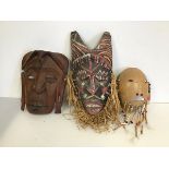 A group of three Tribal masks (largest: 38cm x 17cm)