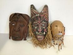 A group of three Tribal masks (largest: 38cm x 17cm)