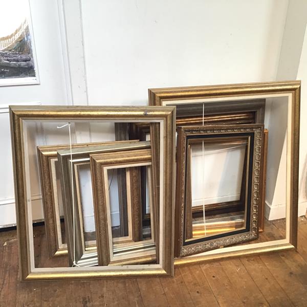A collection of modern frames, some gilt, some moulded (9) (largest: 62cm x 75cm)