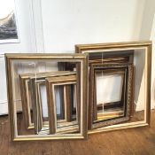 A collection of modern frames, some gilt, some moulded (9) (largest: 62cm x 75cm)