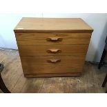 A modern chest of drawers with rectangular top above three graduated drawers, on castors (70cm x