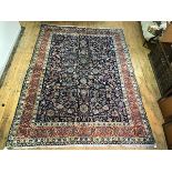 A finely knotted Persian Ziegler carpet, the centre design with trailing lotus flower, leaf and bird
