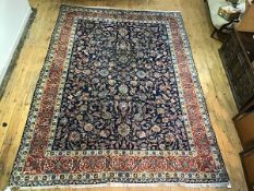 A finely knotted Persian Ziegler carpet, the centre design with trailing lotus flower, leaf and bird