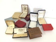 A collection of modern and vintage jewellery boxes including Goldsmiths & Silversmiths Co. London,