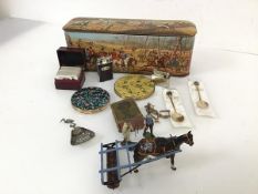 A mixed lot including a biscuit tin with Hunting scene, diecast figures and horse pulling a