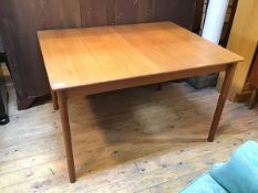 A Mackintosh 1960s teak extendable dining table with magic leaf, on turned straight supports (