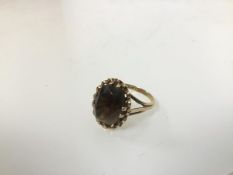 A 9ct gold ring with single citrine in claw setting (O) (4.12g)