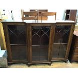 12A reproduction mahogany breakfront bookcase with three glazed doors with fluted pilasters, on