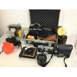 A large assortment of photography equipment including a Samuri 4.0 (13cm x 15cm x 9cm), a Nicca 3-F,