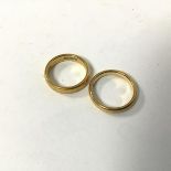 A pair of 22ct gold rings (H and G) (combined: 7.56g)
