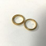 A pair of 22ct gold rings (H and G) (combined: 7.56g)