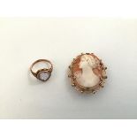 A 9ct gold mounted shell cameo brooch, 20thc., oval with female profile bust, together with an