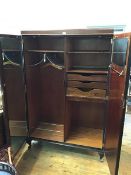 A 1930s/40s mahogany gentleman's Compactum wardrobe with fitted interior, including drawers and