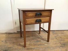 An early 20thc side table with two drawers, on straight supports united by side stretchers ((69cm