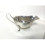 A 1930s Birmingham silver sauceboat, inscribed Wilson & Sharp Ltd., Edinburgh to base (7cm x 15cm