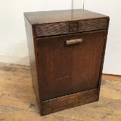 A 1920s oak coal purdonium, lacking metal liner (53cm x 37cm x 34cm)