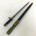 A British pattern 1913 Enfield/Remington bayonet with leather scabbard and canvas frog (58cm)