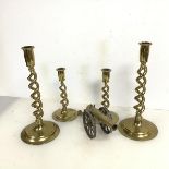 A pair of brass double barley twist candlesticks (30cm), a pair of smaller similar candlesticks