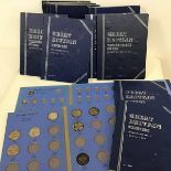 A group of coin albums, several manufactured by Whitman, for coins including pennies, florins,
