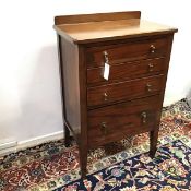 A neat chest of drawers, the top with ledgeback above four graduated drawers, with teardrop pulls,
