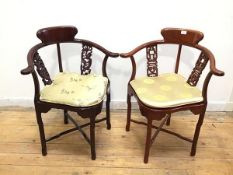 A near pair of Chinese hardwood corner chairs, one with dragon carved splats, the other with