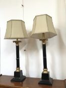 A pair of metal Corinthian column style table lamps complete with hexagonal shades (to top of shade: