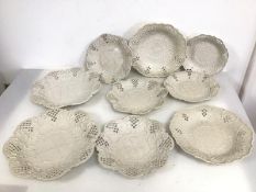 A group of first quarter of the 19thc creamware plates, all with reticulated edges and C scroll